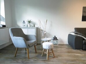 Departamento Grand | �Área de sala de estar | Televisión de pantalla plana 