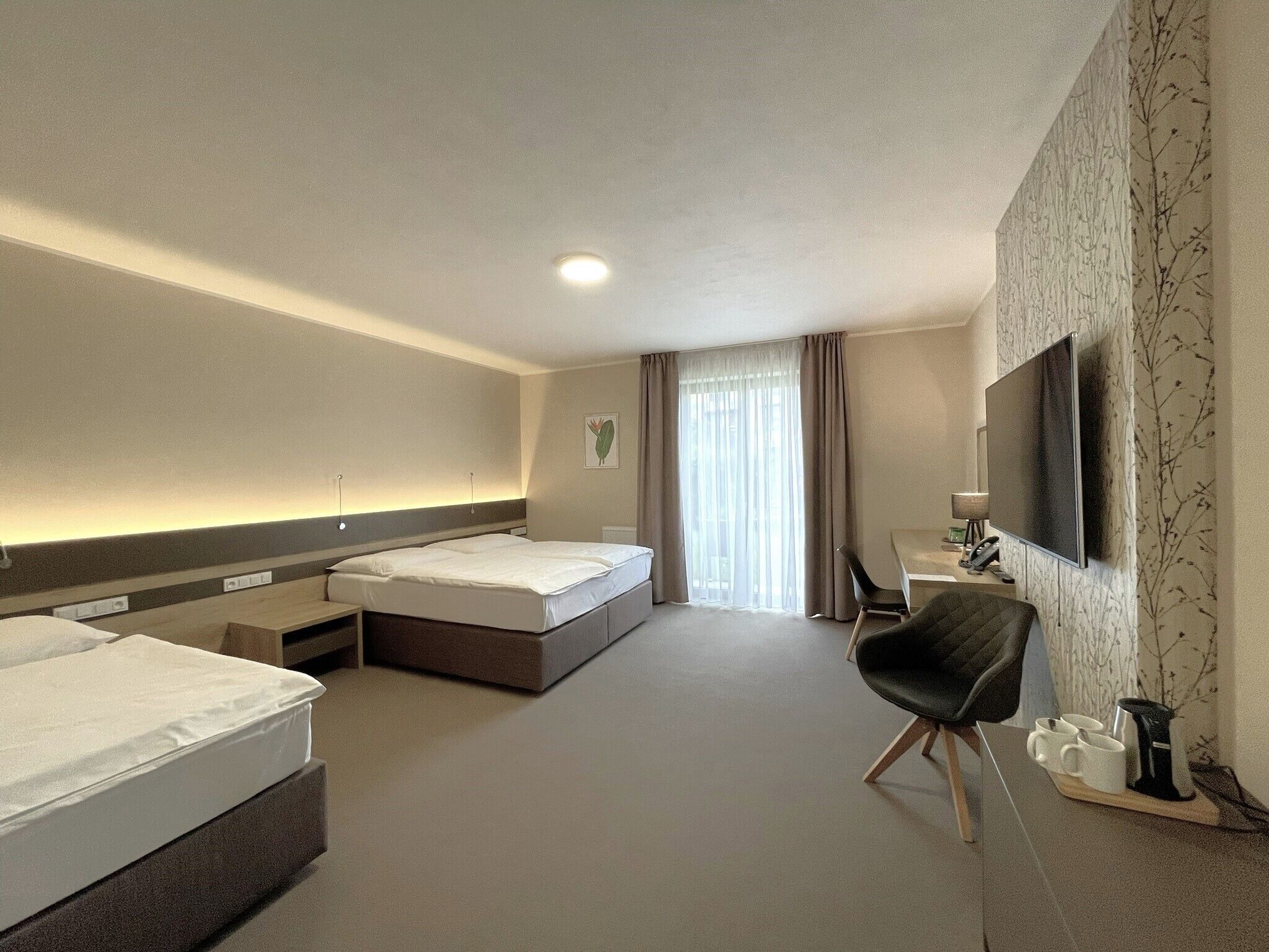 Triple Room, Garden Area | Minibar, in-room safe, desk, laptop workspace