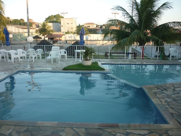 2 outdoor pools, open 9 AM to 6 PM, pool umbrellas, pool loungers