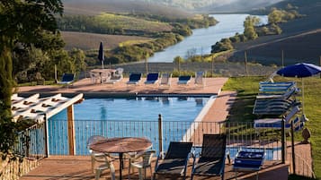 Seasonal outdoor pool, pool umbrellas, pool loungers