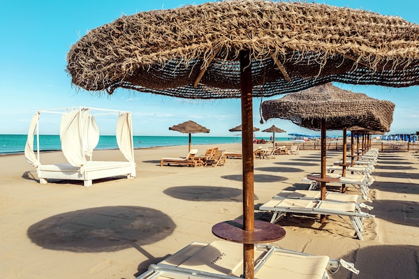 Private beach, white sand, sun loungers, beach umbrellas