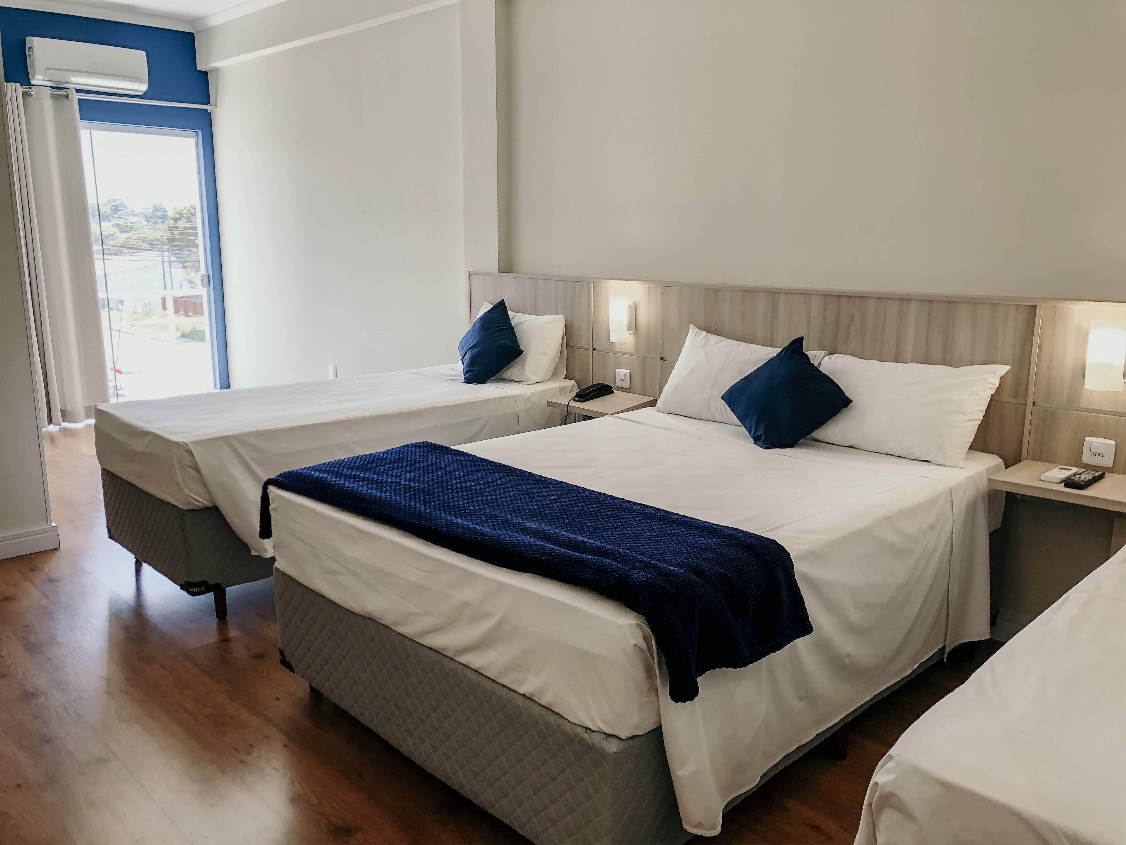 standard quadruple room, non smoking | 1 bedroom, minibar, in-room safe, individually decorated