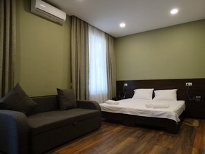 Standard Quadruple Room (202) | Premium bedding, pillowtop beds, soundproofing, iron/ironing board - Hotel Boutique IVERIA  (Tbilisi)