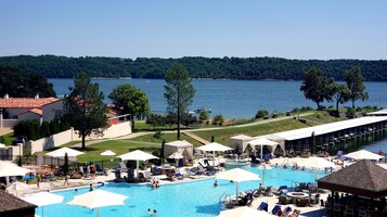 Indoor pool, outdoor pool, pool umbrellas, sun loungers