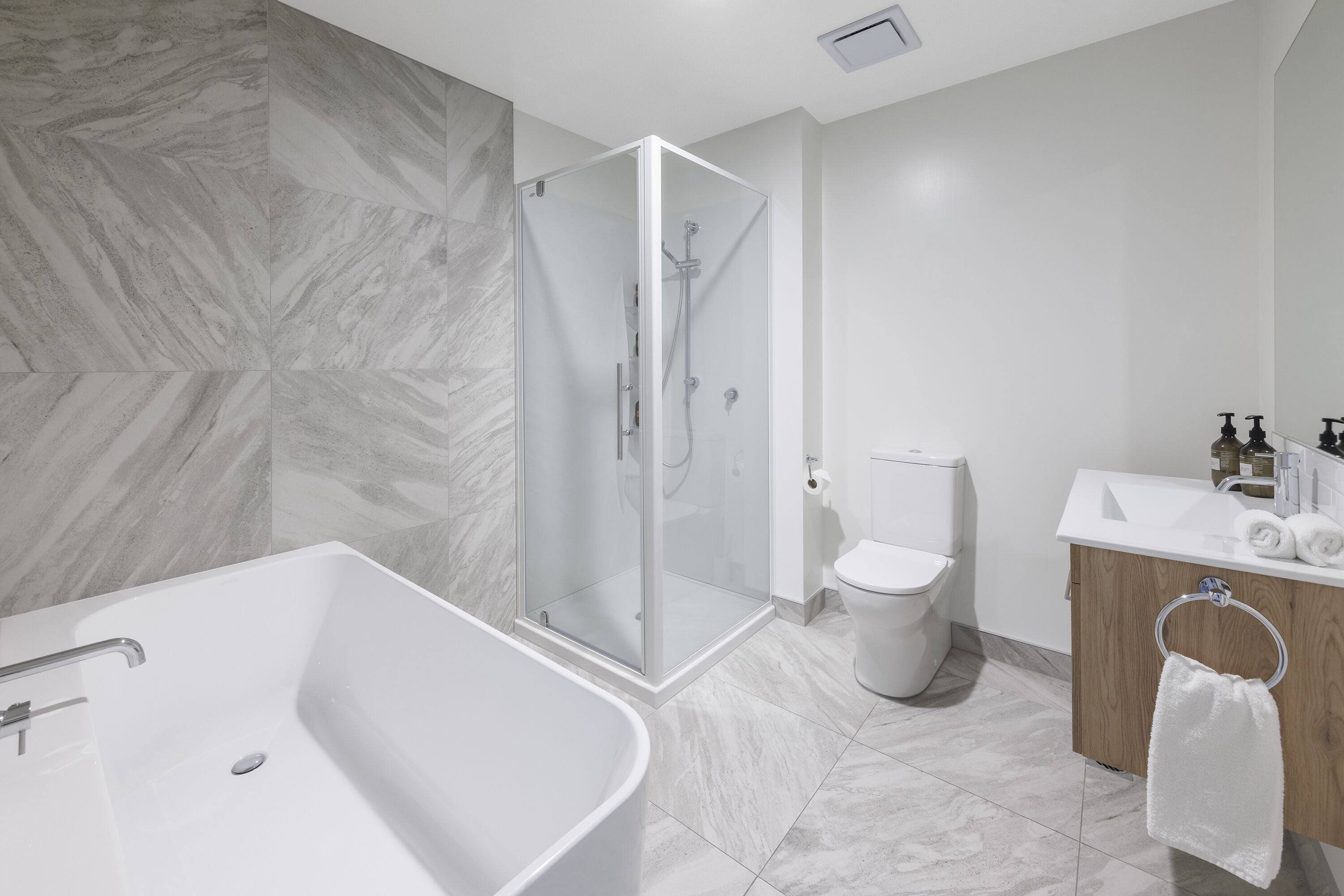 designer toiletries, hair dryer, towels