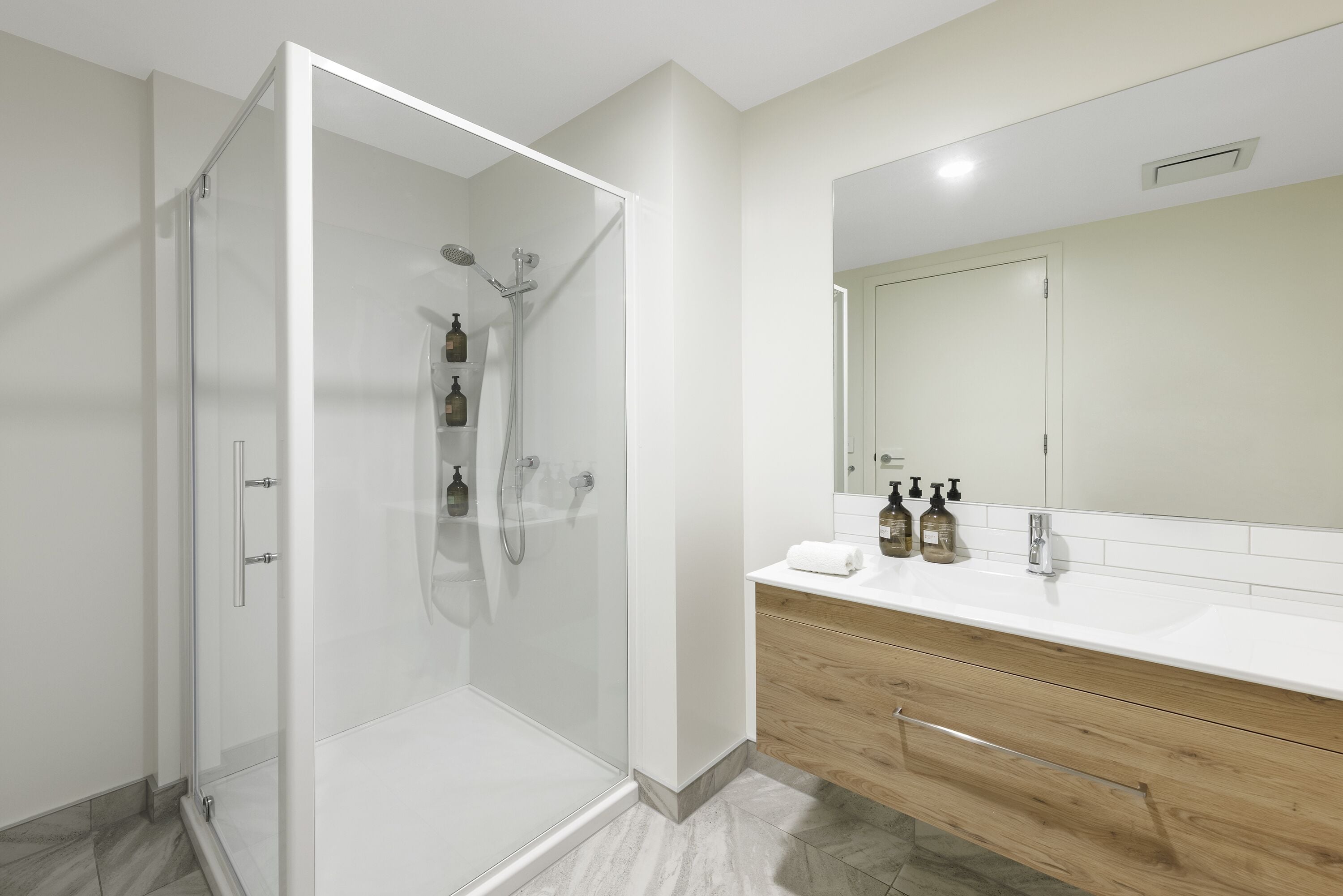 designer toiletries, hair dryer, towels