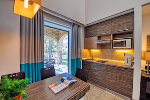 A compact kitchen with a built-in microwave, a sink, and a coffee maker. - Zaton Holiday Resort (Nin)