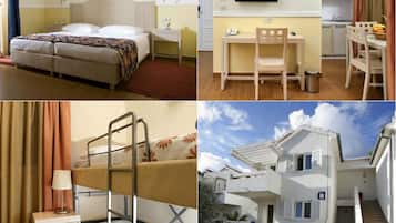 Een hotelkamer met een bed, een bureau, een televisie en uitzicht.