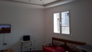 Family Apartment, Smoking | Living area | 32-inch flat-screen TV with satellite channels, TV - Appartements Aloui Foued (Tabarka)