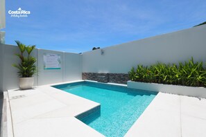 Outdoor pool, pool umbrellas, sun loungers