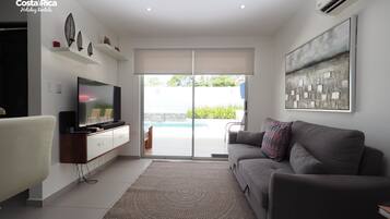 Exclusive House, 2 Bedrooms, Non Smoking, Pool View | Living room | Flat-screen TV