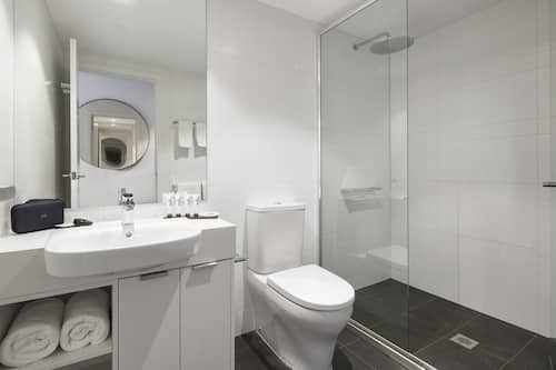 Shower, rainfall showerhead, designer toiletries, hair dryer