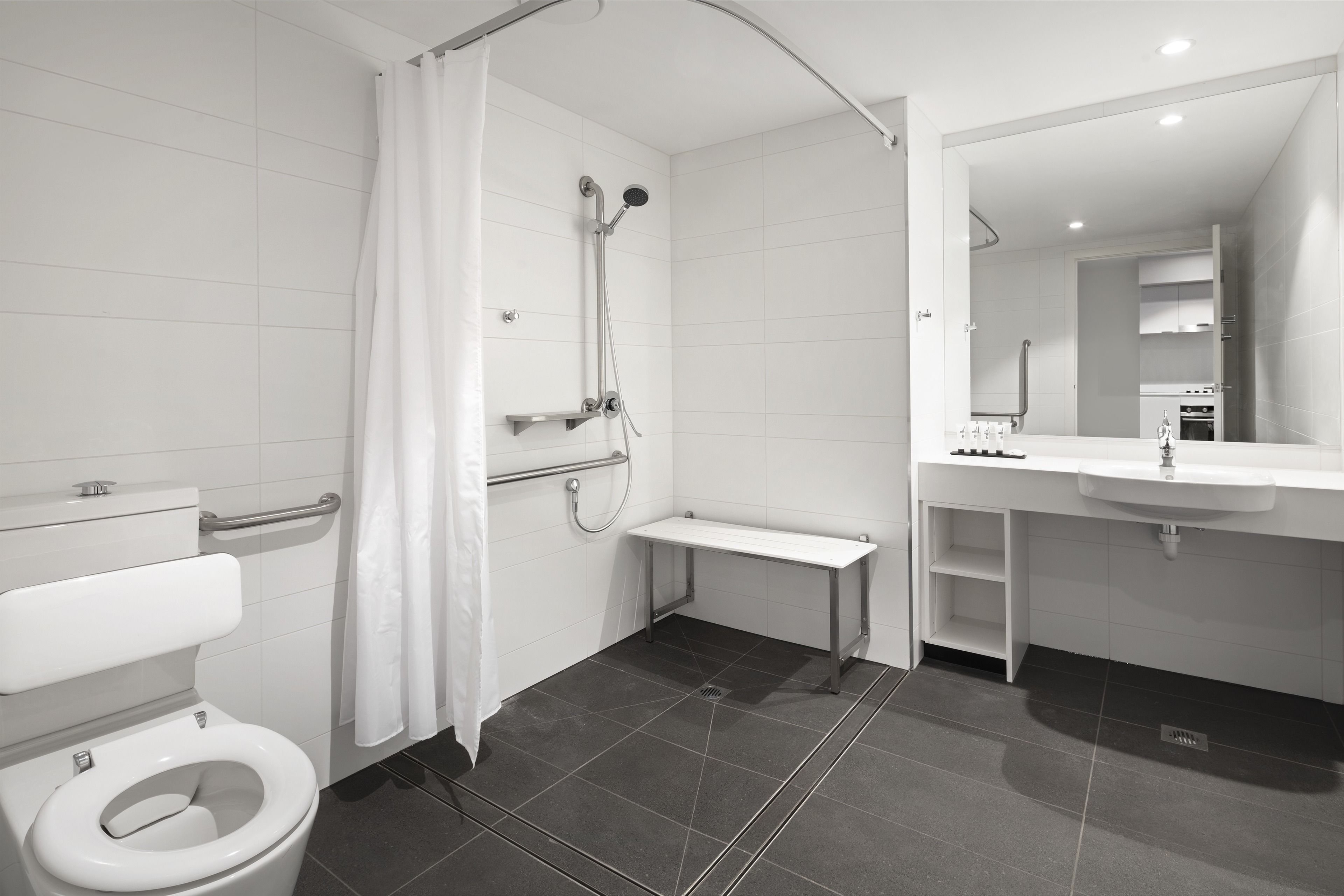 studio accessible apartment | bathroom | shower, rainfall showerhead, designer toiletries, hair dryer