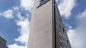 A tall building with a prominent clock and the text "Best Western" on its facade. - Best Western Hotel Fino Tokyo Akihabara (Tokyo)