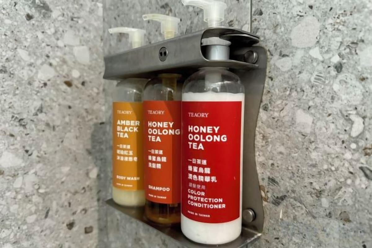Eco-friendly toiletries, hair dryer, slippers, towels