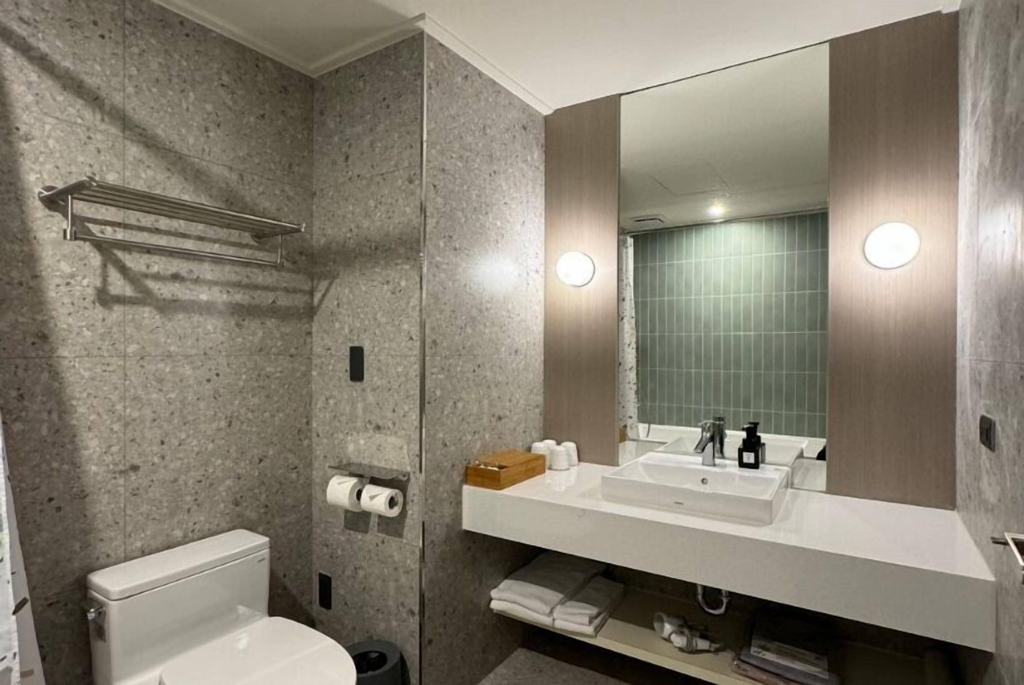 economy quadruple room | bathroom | eco-friendly toiletries, hair dryer, slippers, towels