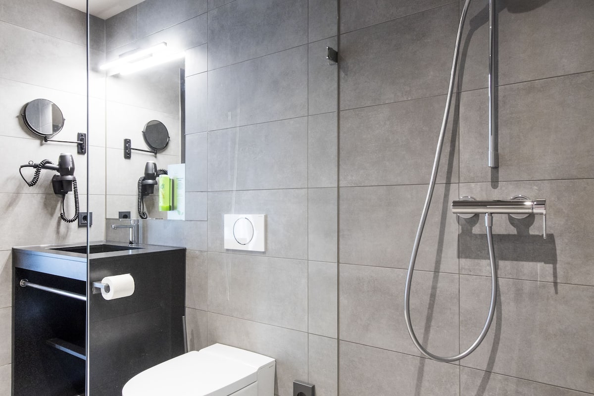 shower, hair dryer, heated floors, towels