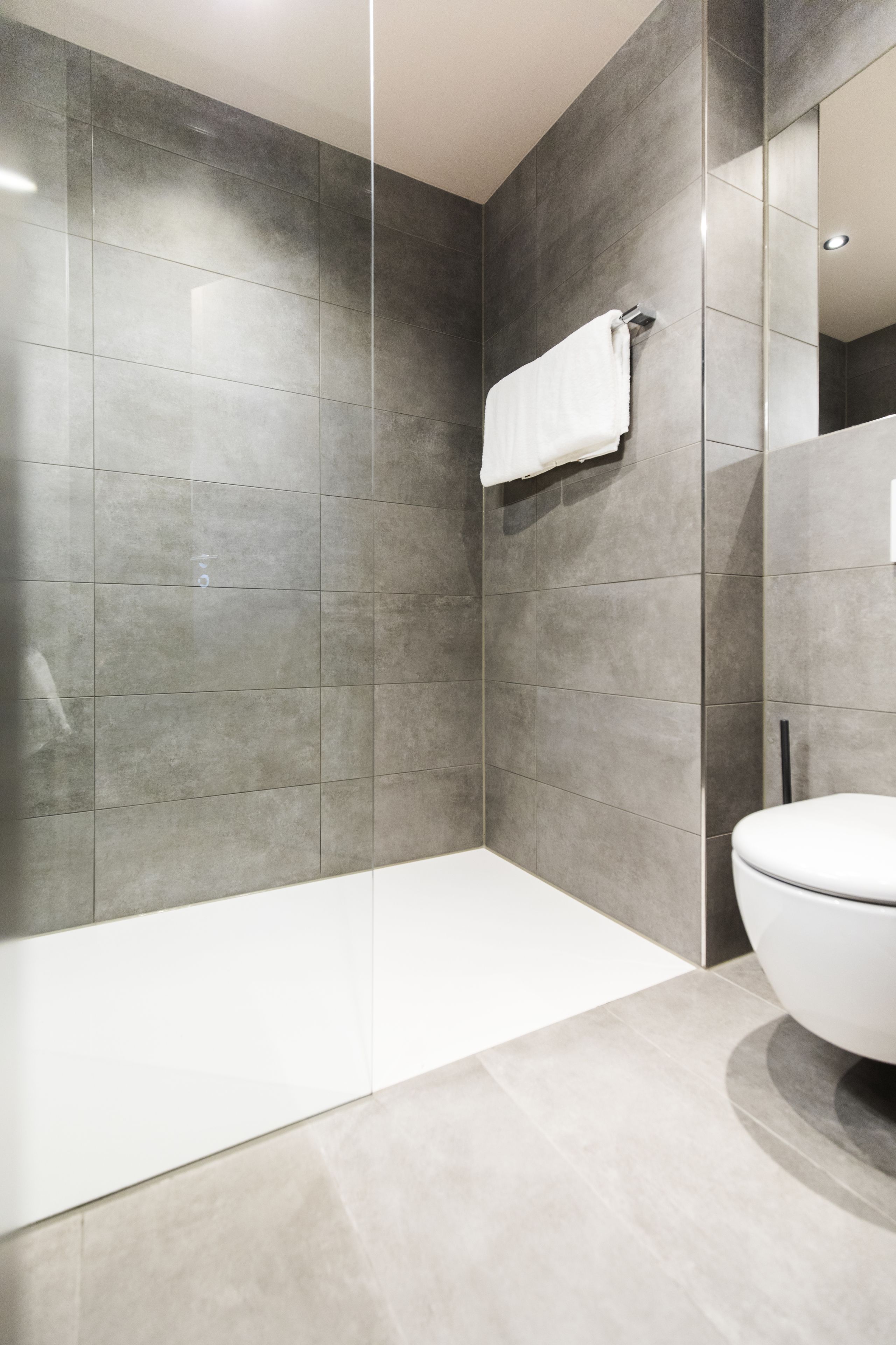 shower, hair dryer, heated floors, towels