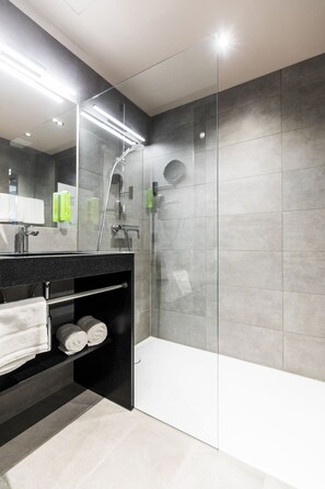 Shower, hair dryer, heated floors, towels