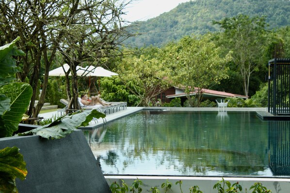 Outdoor pool, pool umbrellas, sun loungers