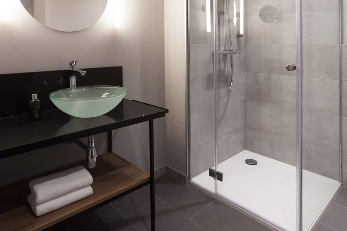 Shower, rainfall showerhead, hair dryer, towels