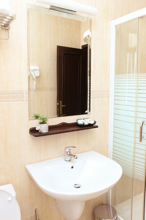 Shower, free toiletries, hair dryer, towels