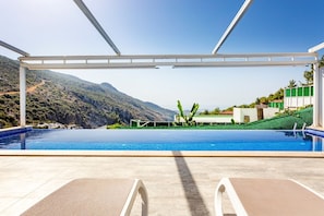 Outdoor pool, a heated pool, pool loungers