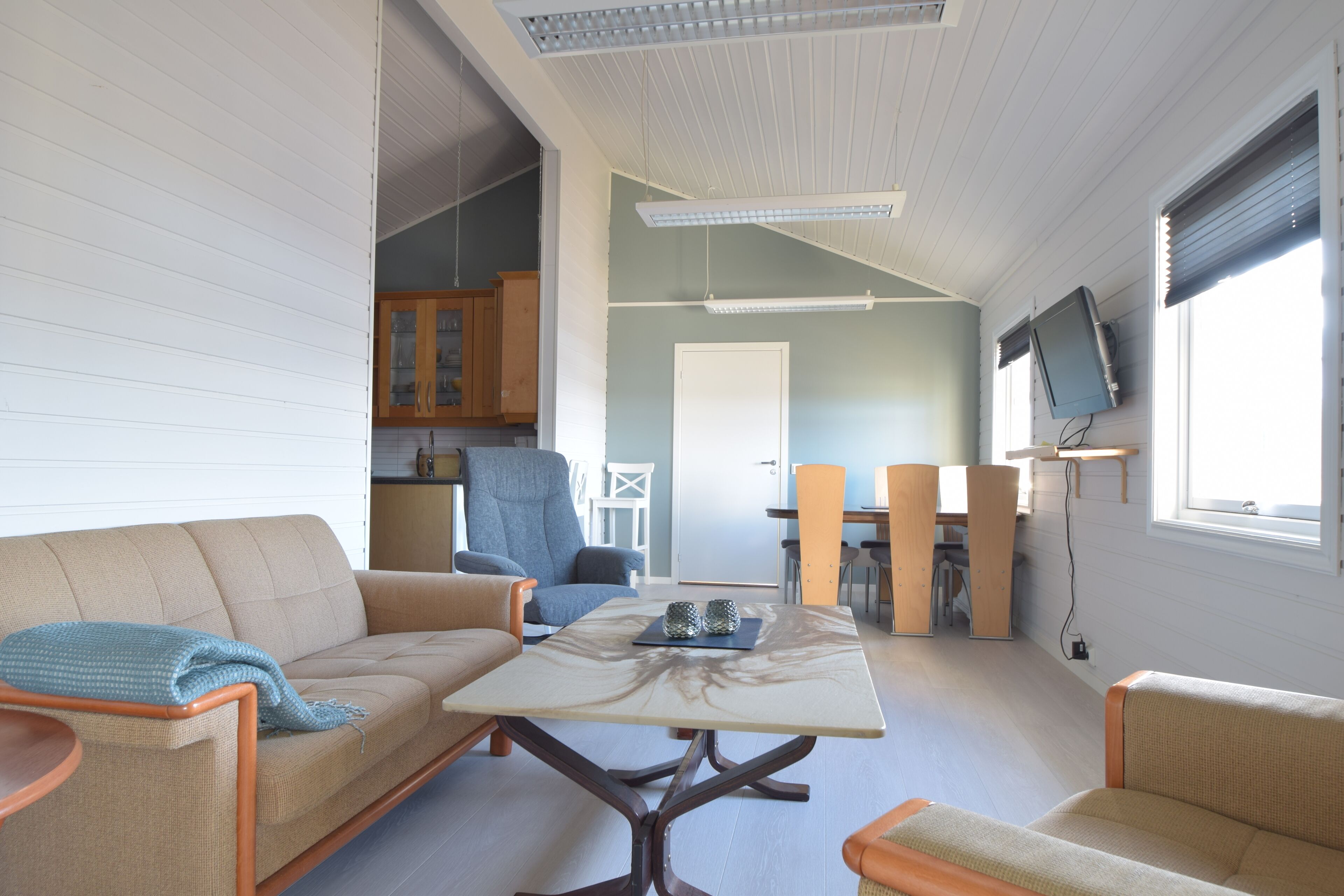 Standard Apartment | Living area | 55-inch flat-screen TV with satellite channels, TV, heated floors