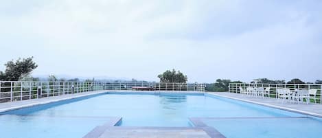 Outdoor pool, open 8 AM to 7:00 PM, pool umbrellas, pool loungers