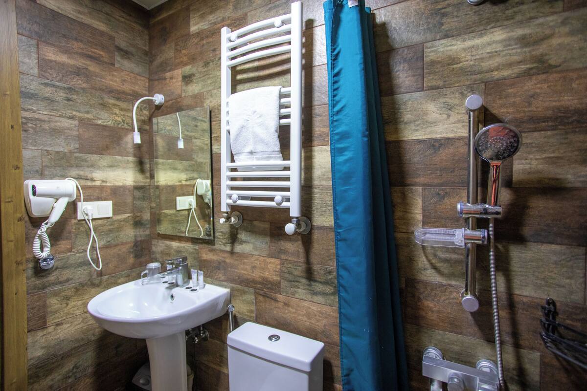 family room | bathroom | shower, free toiletries, hair dryer, slippers