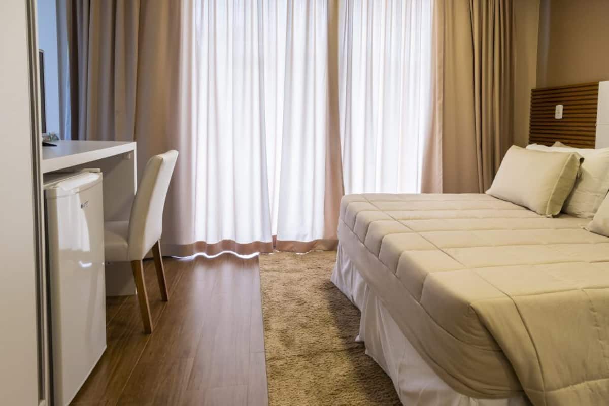 Junior Suite | Minibar, in-room safe, individually decorated, blackout curtains