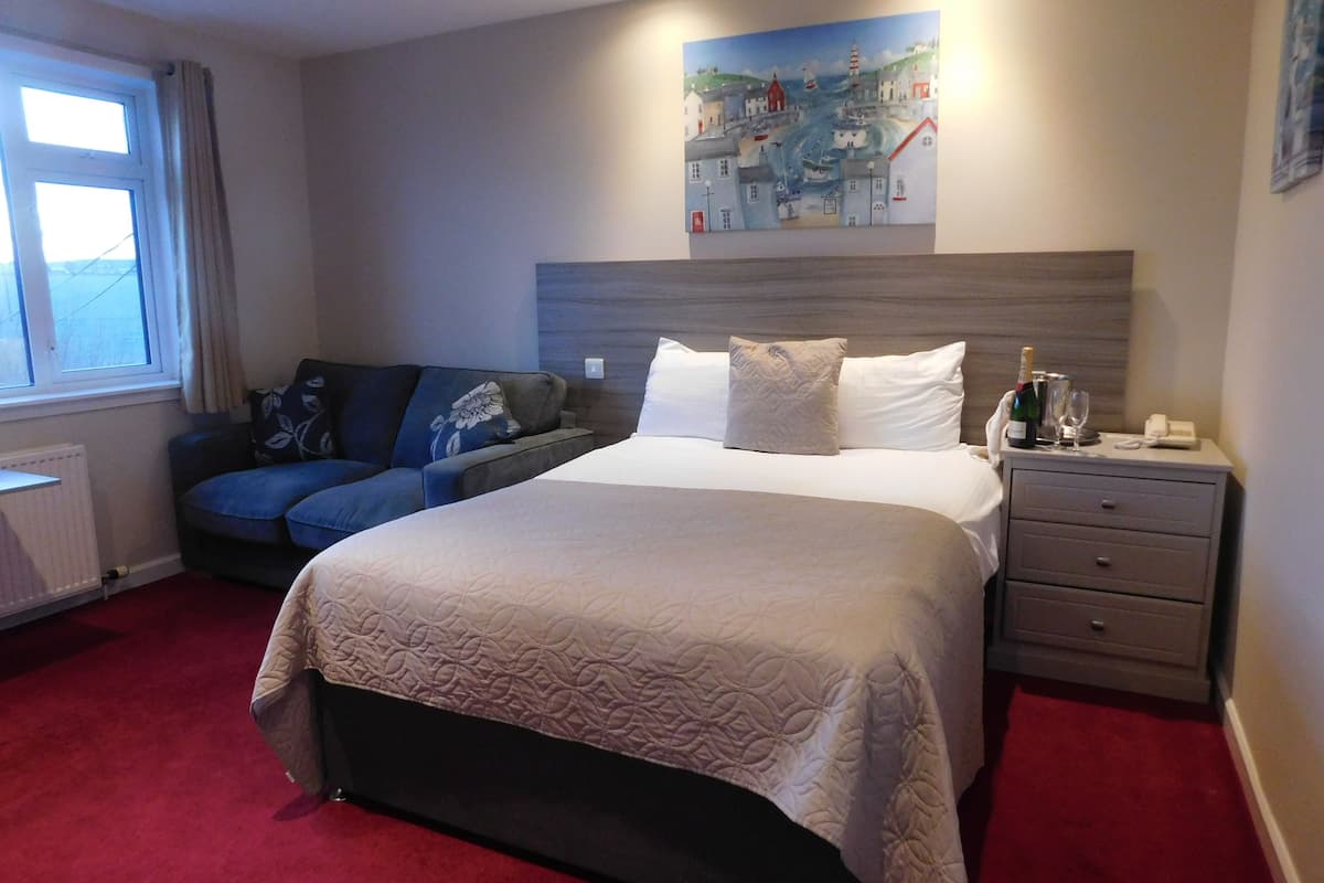 Premium bedding, blackout curtains, iron/ironing board, free WiFi