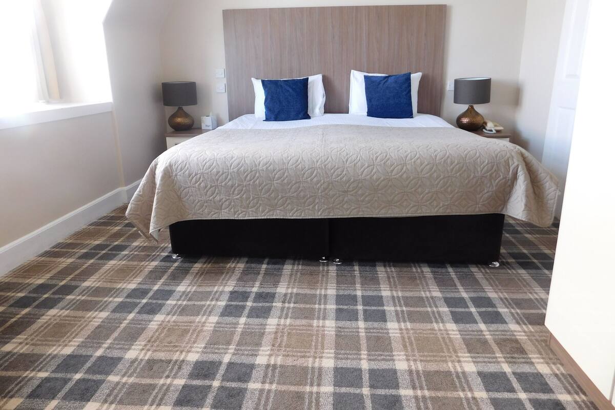 Premium bedding, blackout drapes, iron/ironing board (on request)