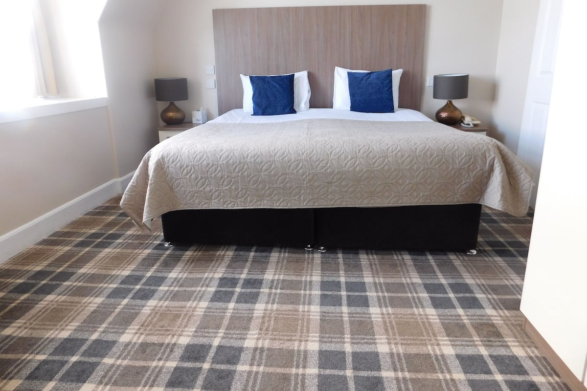 Premium bedding, blackout curtains, iron/ironing board, free WiFi