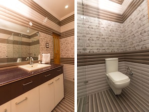 A bathroom with a sink, mirror, and toilet. - OYO 16593 Home Luxury 3BHK Galaxy Villa Andrar (Dharamshala)