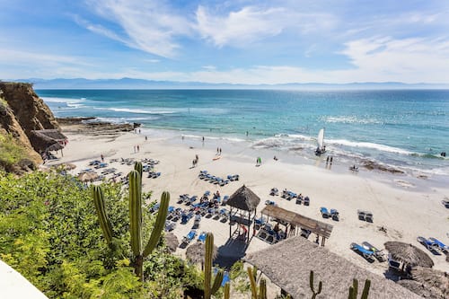 On the beach, sun loungers, beach umbrellas, beach towels
