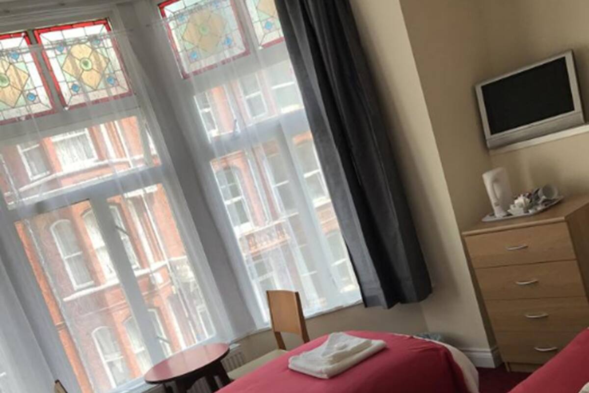 Twin Room | Blackout drapes, WiFi (free), bed sheets
