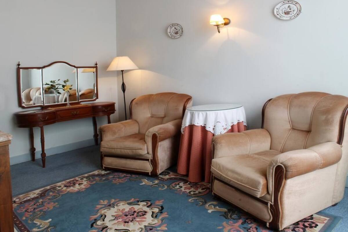 Suite Junior (2 Adults + 2 Children - 12 years) | Coin séjour