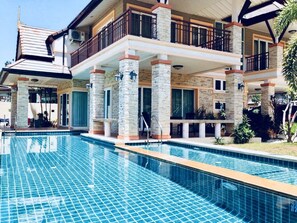 A two-story building with a swimming pool. - Zens Element (Chalong)