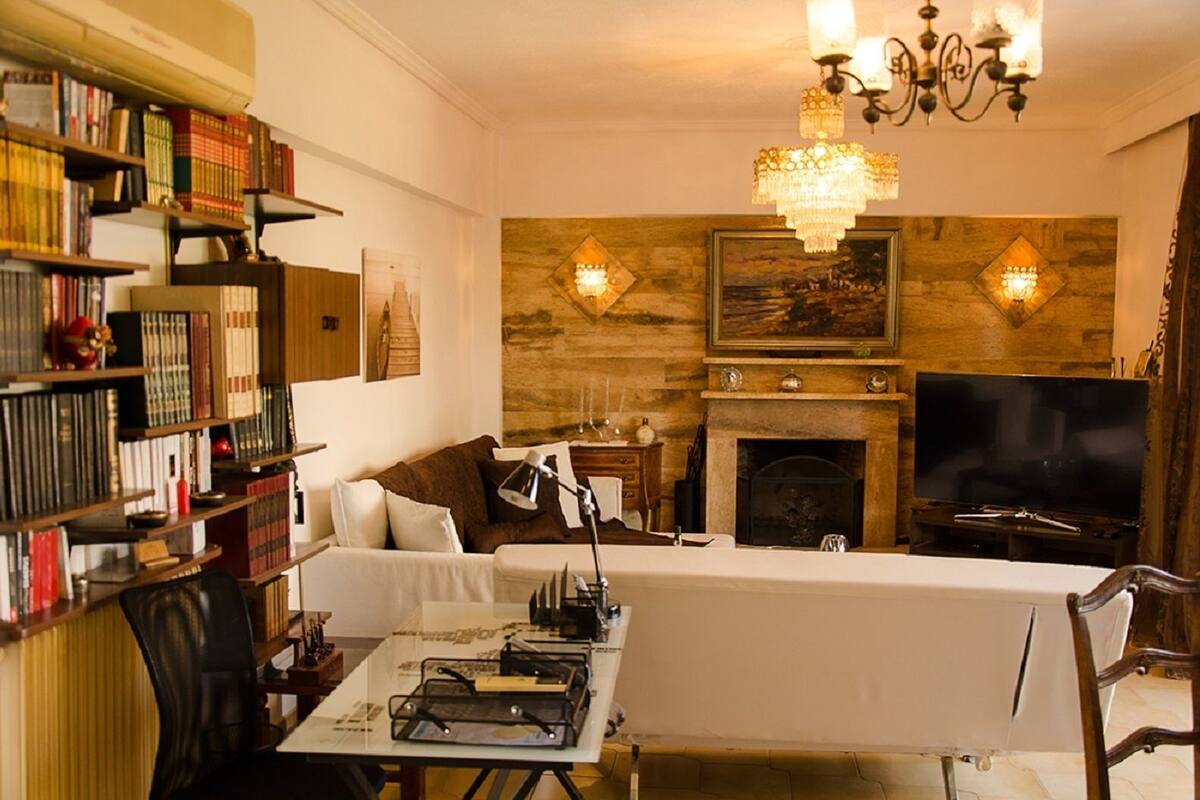 Deluxe Apartment, 2 Bedrooms | Living room | 50-inch Smart TV with satellite channels, TV, fireplace