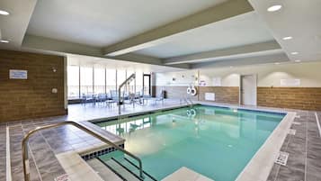 Indoor pool, open 9:00 AM to 9:00 PM, pool loungers