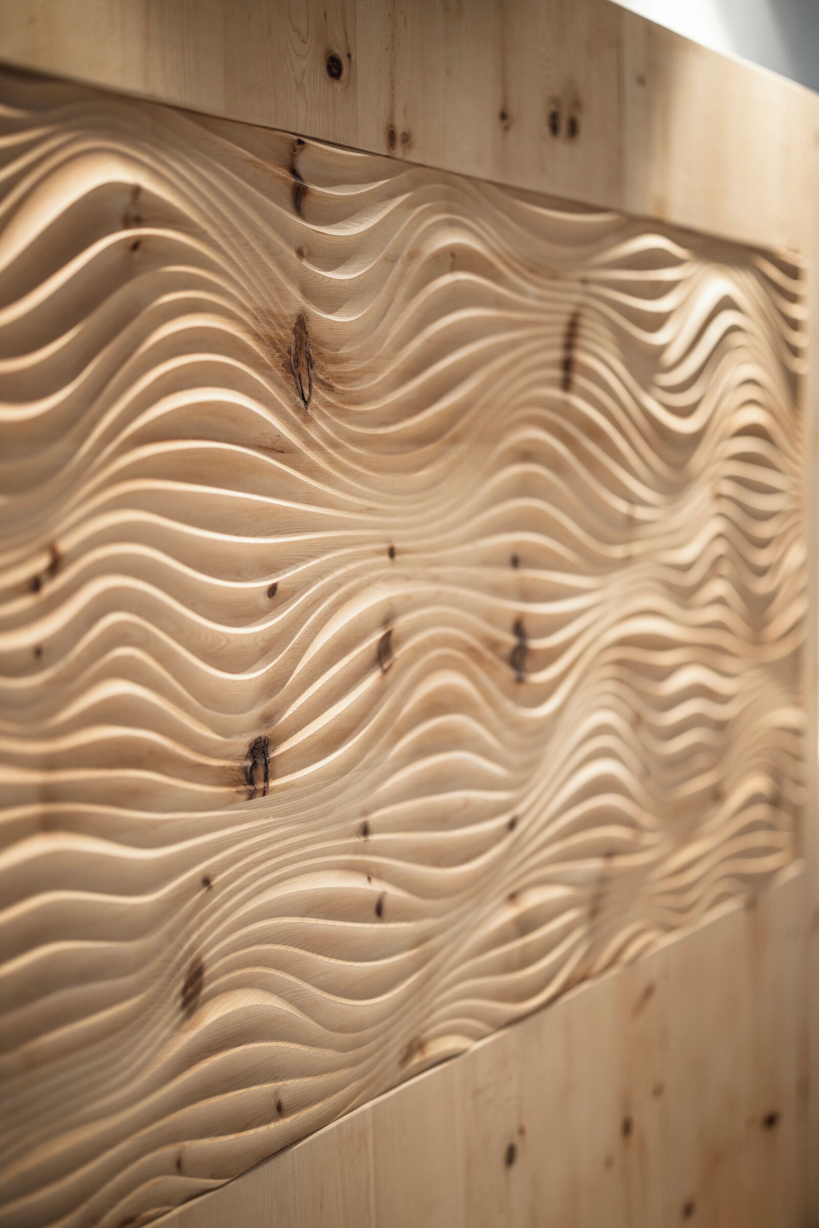 A wooden wall with a wavy, textured pattern.