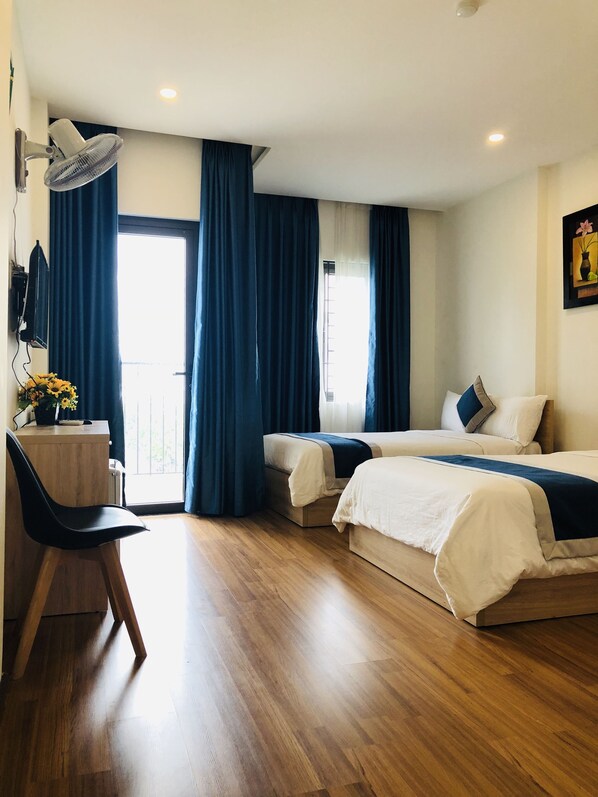 Family Room | Minibar, desk, iron/ironing board, free WiFi - Hanoi Hotel (Da Nang)