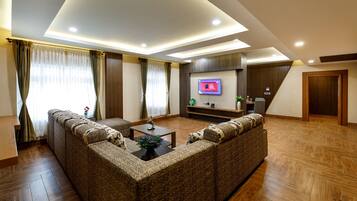 Luxury Suite, Multiple Beds, Non Smoking | Living room | 42-inch LED TV with satellite channels, TV
