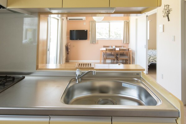 Two-Bedroom Apartment 202	 | Private kitchenette | Fridge, microwave, stovetop, coffee/tea maker