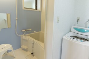 Two-Bedroom Apartment 202	 | Bathroom | Separate tub and shower, free toiletries, hair dryer, towels - Park View Aoshima (Miyazaki)