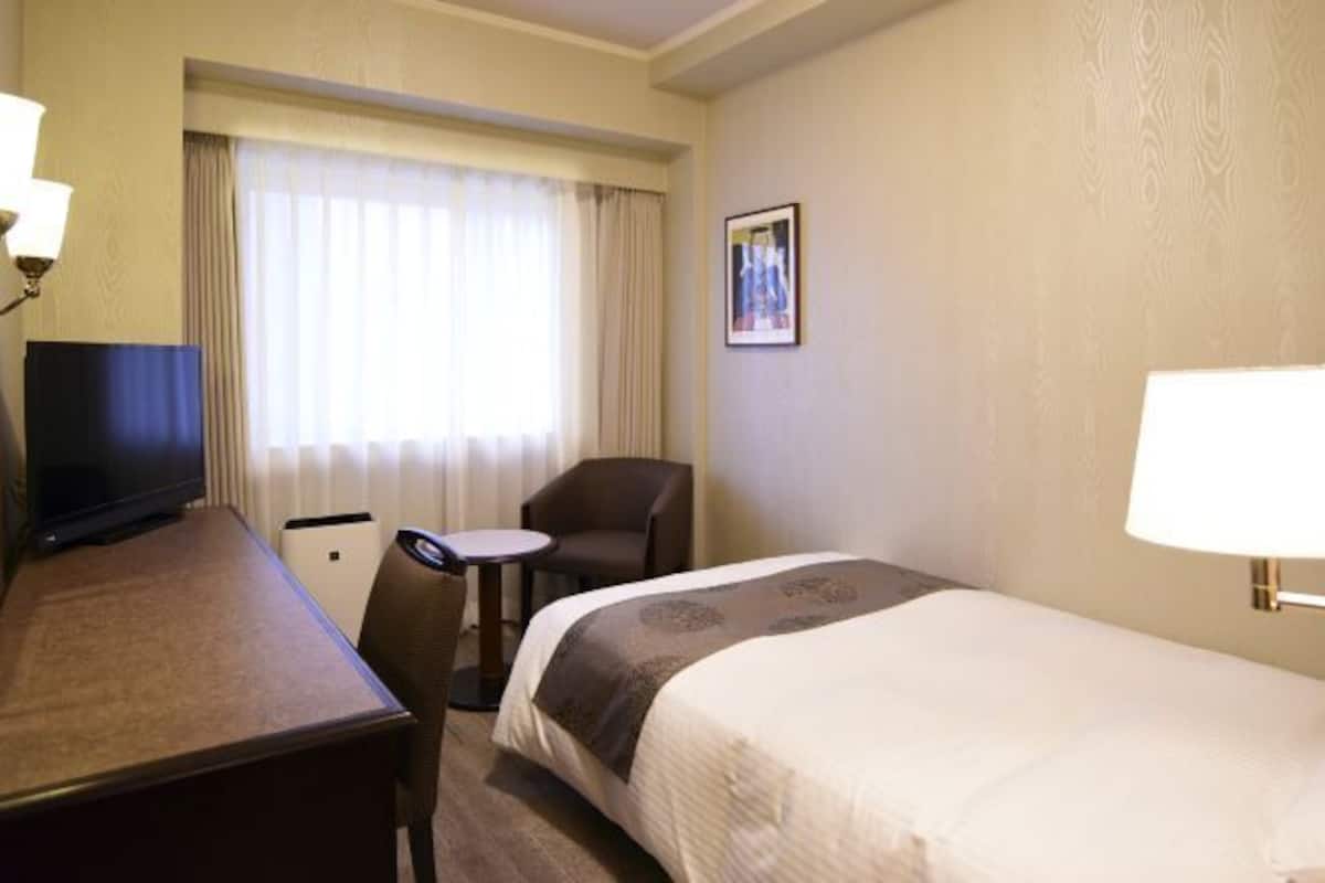 Desk, laptop workspace, blackout drapes, soundproofing