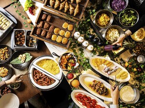 A buffet with various dishes including sausages, salads, and bread. - ibis Osaka Umeda (Osaka)