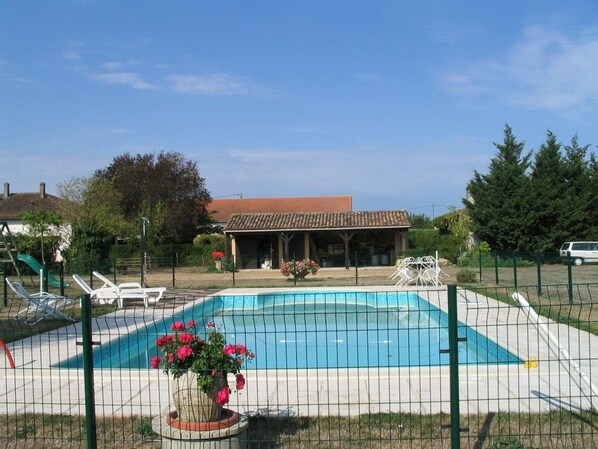 Seasonal outdoor pool, open 10 AM to 7:30 PM, pool umbrellas