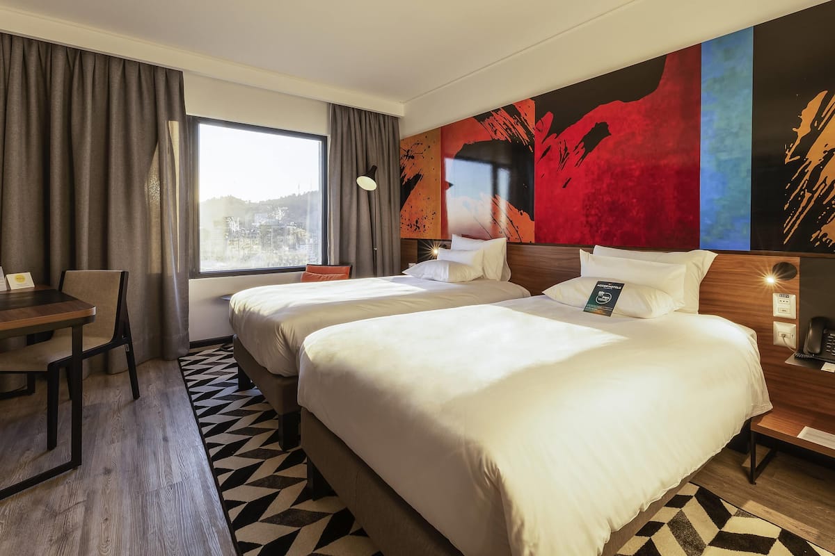 Superior Twin Room | Minibar, in-room safe, desk, laptop workspace